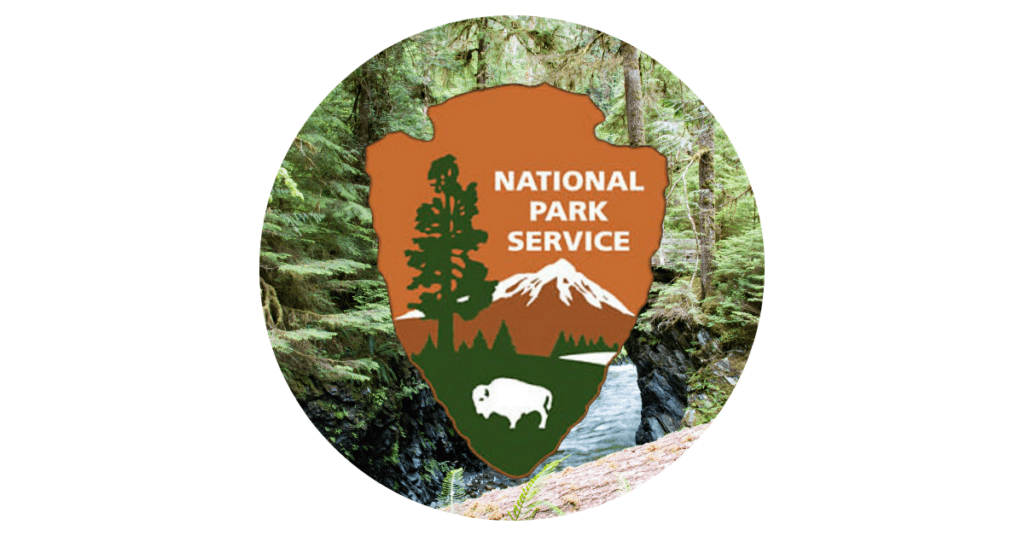 US National Park Service logo on a forest background